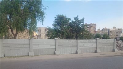 بالصور، محافظة الجيزة: بدء تركيب أسوار خرسانية بشارع فيصل لمنع إلقاء المخلفات